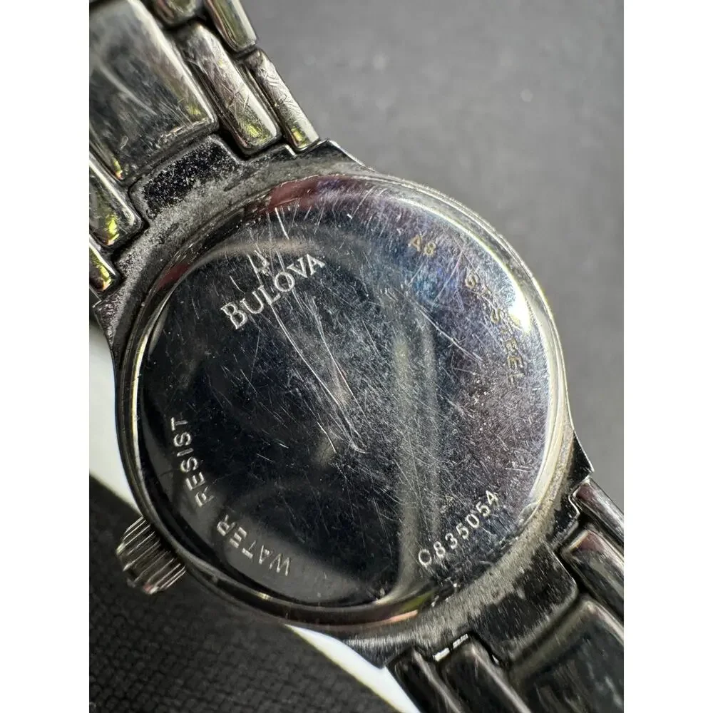 Vtg Caravelle by Bulova Silver Tone White Dial Diamond Accent Women’s Watch 24mm
